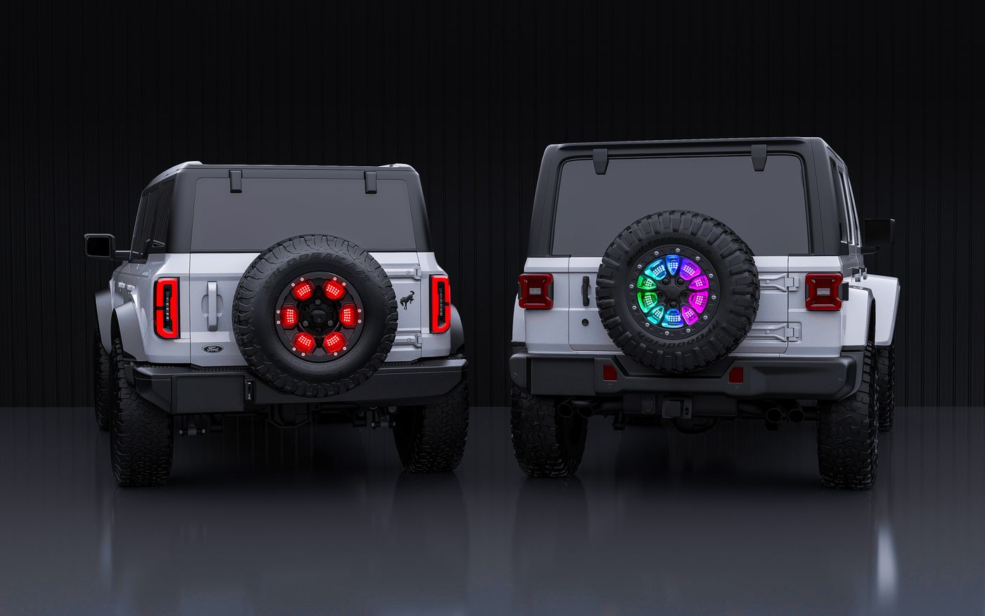 XKmax 5th wheel light on a Ford Bronco and a Jeep Wrangler, one lit red and one in rainbow show mode