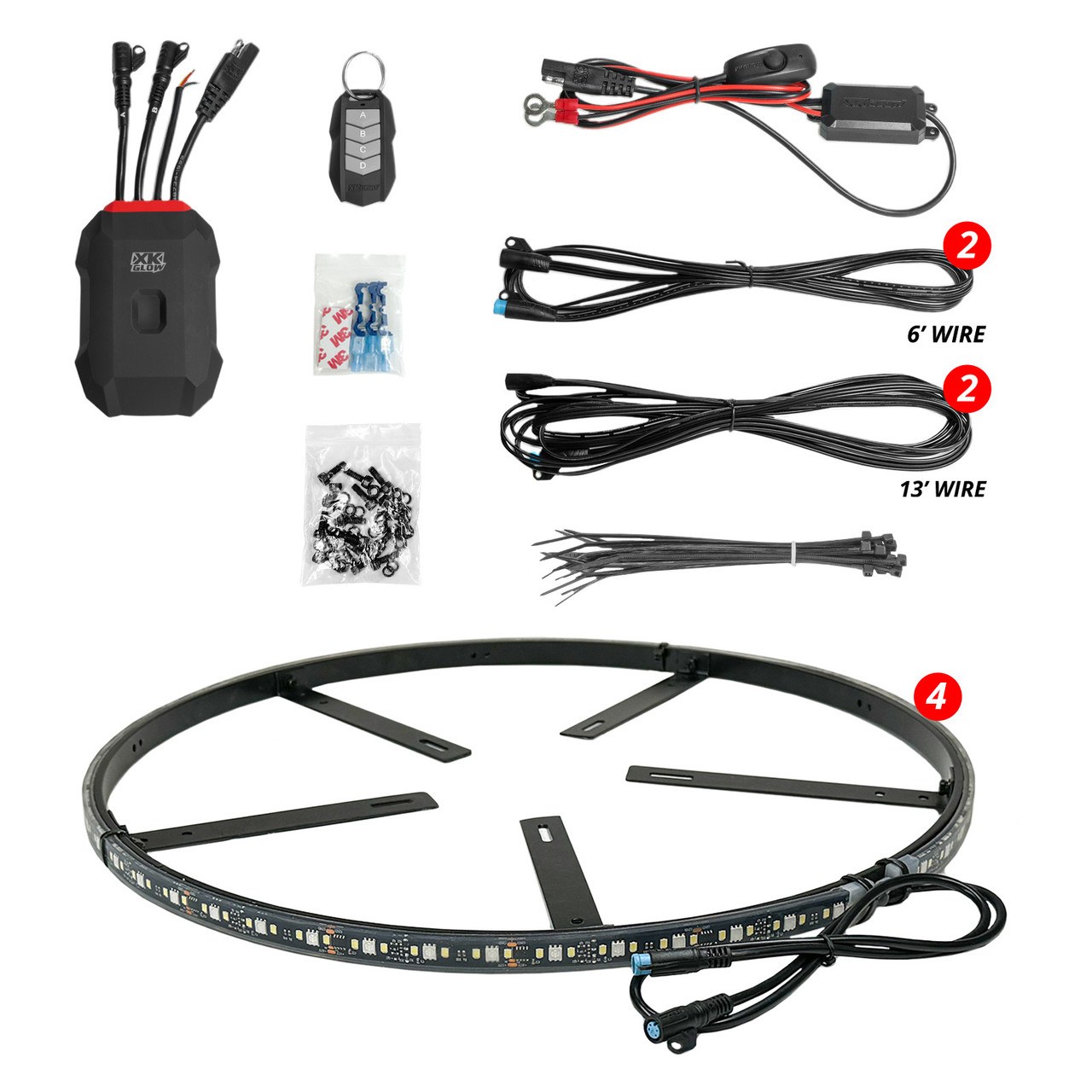 Wheel ring light kit laid out with a controller, key fob, wires, hardware bags, and one LED ring with mounting arms